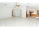 Open-concept living room with easy flow to the kitchen at 7435 Redwing Rd, Groveland, FL 34736