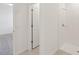 Bathroom with white tiled shower, shower head, and tile floor, offers a clean and modern look at 800 Griffon Ave, Lake Alfred, FL 33850