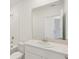 Cozy bathroom featuring a sleek vanity with a white countertop at 800 Griffon Ave, Lake Alfred, FL 33850