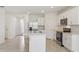 Modern kitchen featuring stainless steel appliances, white cabinetry, and center island at 800 Griffon Ave, Lake Alfred, FL 33850