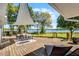 Outdoor living area on wood deck overlooking a large yard and waterfront at 801 Springview Dr, Orlando, FL 32803