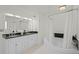 Elegant bathroom with a soaking tub, dual sink vanity, and white cabinets at 801 Springview Dr, Orlando, FL 32803