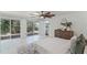 Bright bedroom featuring white tile, sliding glass doors, and waterfront view at 801 Springview Dr, Orlando, FL 32803