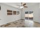 Spacious bedroom with tile floor, ceiling fan, and sliding glass door to yard at 801 Springview Dr, Orlando, FL 32803