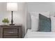 Stylishly furnished bedroom with wood nightstand and a decorative lamp at 801 Springview Dr, Orlando, FL 32803