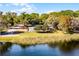 Scenic aerial view of home with lush landscaping, waterfront, and inviting outdoor space at 801 Springview Dr, Orlando, FL 32803