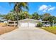 Charming home featuring a two-car garage, a covered parking area, and well-maintained landscaping at 801 Springview Dr, Orlando, FL 32803