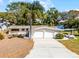 Charming home featuring a two-car garage, a well-manicured lawn, and a stylish carport at 801 Springview Dr, Orlando, FL 32803