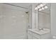 This bathroom offers a shower and bath combination with a wide vanity and mirror at 8338 Quimby Cir, Davenport, FL 33896