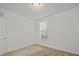 This bright bedroom features neutral carpeting and a window with white blinds at 8338 Quimby Cir, Davenport, FL 33896