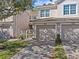 Charming townhome featuring a two-car garage and inviting curb appeal in a manicured community at 8338 Quimby Cir, Davenport, FL 33896