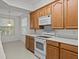 Kitchen featuring ample cabinetry, modern appliances, and a bright, airy atmosphere at 8338 Quimby Cir, Davenport, FL 33896