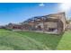 Expansive backyard with a view of the screened-in pool and patio area at 1028 Orange Cosmos Blvd, Davenport, FL 33837