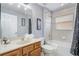 Well-lit bathroom with a tub-shower combination, vanity, and neutral tones offering a clean and functional space at 1028 Orange Cosmos Blvd, Davenport, FL 33837