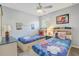 Playful bedroom with twin beds and superhero-themed decor, perfect for a fun and imaginative space at 1028 Orange Cosmos Blvd, Davenport, FL 33837