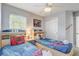 Whimsical ' bedroom with themed bedding, artwork, and practical storage solutions, designed for comfort and fun at 1028 Orange Cosmos Blvd, Davenport, FL 33837