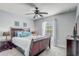 Serene bedroom featuring a ceiling fan, soft lighting, and coordinated decor providing a peaceful ambiance at 1028 Orange Cosmos Blvd, Davenport, FL 33837