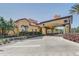 An inviting clubhouse entrance with meticulous landscaping, elegant archway, and decorative clock tower at 1028 Orange Cosmos Blvd, Davenport, FL 33837