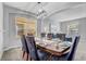 Inviting dining room with modern light fixture and seating for Gathering and entertaining at 1028 Orange Cosmos Blvd, Davenport, FL 33837