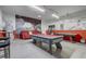 Large game room featuring seating, pool table, shuffleboard, and sports themed wall decor at 1028 Orange Cosmos Blvd, Davenport, FL 33837