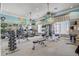 Community gym with a variety of exercise equipment and natural light streaming through the windows at 1028 Orange Cosmos Blvd, Davenport, FL 33837