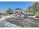 Community playground with slide, landscaping, and mulch at 1028 Orange Cosmos Blvd, Davenport, FL 33837