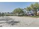 Community beach volleyball court next to a playground at 1028 Orange Cosmos Blvd, Davenport, FL 33837