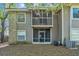 A multi-level screened patio, exterior AC unit, and shaded backyard at 109 Reserve Cir # 201, Oviedo, FL 32765