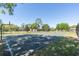 Outdoor basketball court with trees and apartment complex in the background at 109 Reserve Cir # 201, Oviedo, FL 32765