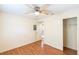 Bedroom with wood-look floors, ceiling fan, large closet, and neutral paint at 109 Reserve Cir # 201, Oviedo, FL 32765