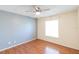 Bright bedroom with hardwood floors, neutral paint, and a ceiling fan at 109 Reserve Cir # 201, Oviedo, FL 32765