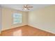 Bedroom featuring hardwood floors, natural light, and a ceiling fan at 109 Reserve Cir # 201, Oviedo, FL 32765