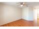 Bedroom with hardwood floors, a ceiling fan, and a closet at 109 Reserve Cir # 201, Oviedo, FL 32765