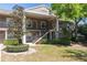 Charming two-story building with lush landscaping and exterior staircase at 109 Reserve Cir # 201, Oviedo, FL 32765