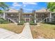 Two-story building with landscaped front yard and stairway to upper units at 109 Reserve Cir # 201, Oviedo, FL 32765