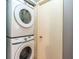 A stackable washer and dryer are conveniently located near a door at 109 Reserve Cir # 201, Oviedo, FL 32765