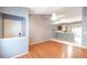 Bright open-concept space with hardwood floors that opens to the kitchen at 109 Reserve Cir # 201, Oviedo, FL 32765