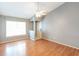 Bright living room with hardwood floors, neutral walls, and vaulted ceiling at 109 Reserve Cir # 201, Oviedo, FL 32765