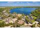 The aerial view showcases the community, nearby lakefront, and manicured yards at 111 Woodstream Ct, Maitland, FL 32751