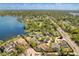 A high angle aerial highlights the neighborhood, the nearby lake, and the area's mature trees at 111 Woodstream Ct, Maitland, FL 32751