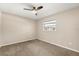 Bedroom featuring a window and a ceiling fan, with carpeted flooring at 111 Woodstream Ct, Maitland, FL 32751