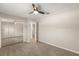 Bedroom with mirrored closet doors, an open door, and carpeted floors at 111 Woodstream Ct, Maitland, FL 32751