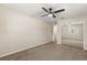 Bedroom showcases mirrored closet doors, neutral walls, ceiling fan, and carpet at 111 Woodstream Ct, Maitland, FL 32751