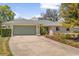 Charming single-story home with a two-car garage and beautifully landscaped front yard at 111 Woodstream Ct, Maitland, FL 32751
