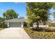 Well-maintained home with a spacious driveway and a lush, green lawn at 111 Woodstream Ct, Maitland, FL 32751