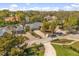 An impressive aerial view highlights this single-story home with mature landscaping and circular driveway at 111 Woodstream Ct, Maitland, FL 32751