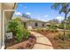 Inviting home exterior with a paved walkway and manicured landscaping at 111 Woodstream Ct, Maitland, FL 32751