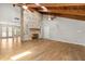 Unique living room featuring a stone fireplace, hardwood floors, and a vaulted ceiling at 111 Woodstream Ct, Maitland, FL 32751