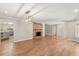 Spacious living room featuring hardwood floors, a brick fireplace, and abundant natural light at 111 Woodstream Ct, Maitland, FL 32751