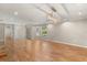Open-concept living room with hardwood floors, modern lighting, and plenty of space at 111 Woodstream Ct, Maitland, FL 32751
